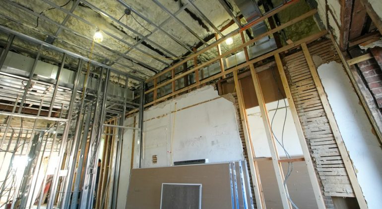 Metal studs and drywall boards during interior construction